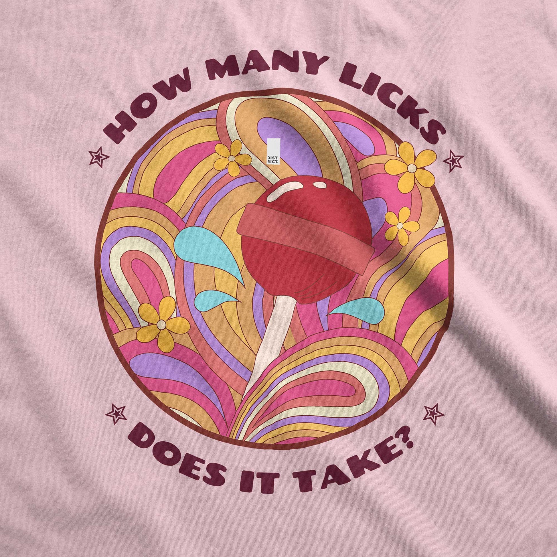 A lilac District 7501 swatch featuring a psychedelic circle with a candy lollipop in the center and the words how many licks does it take.