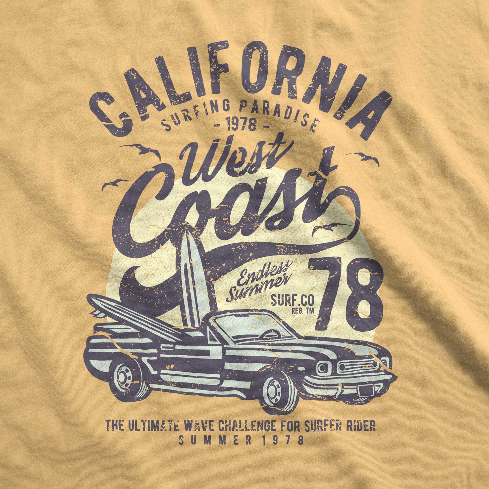 A mustard yellow Comfort Colors swatch with surfboards inside a convertible and the words California west coast surfing paradise