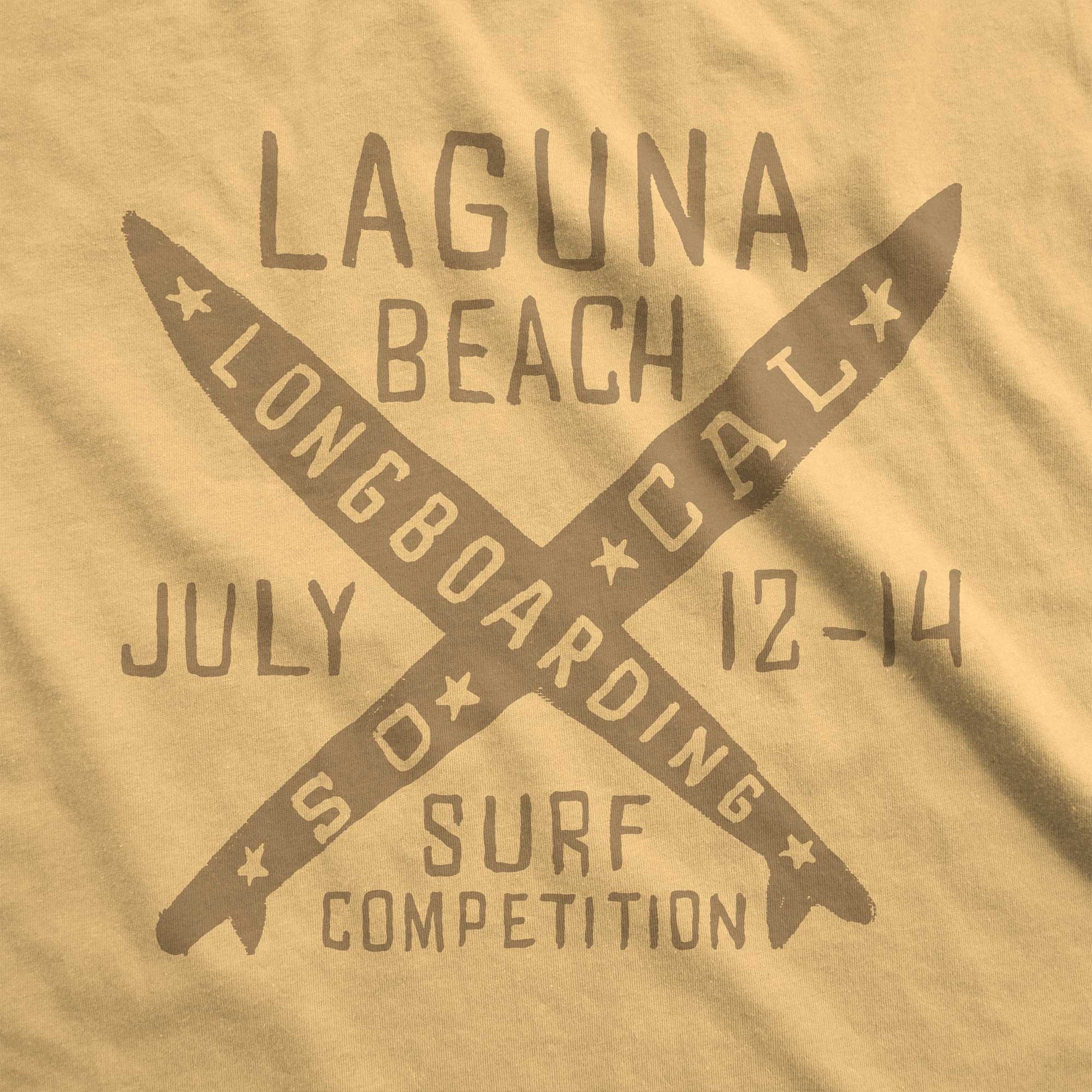 A mustard yellow Comfort Colors swatch featuring 2 crossed longboards and the words Laguna Beach surf competition in brown ink