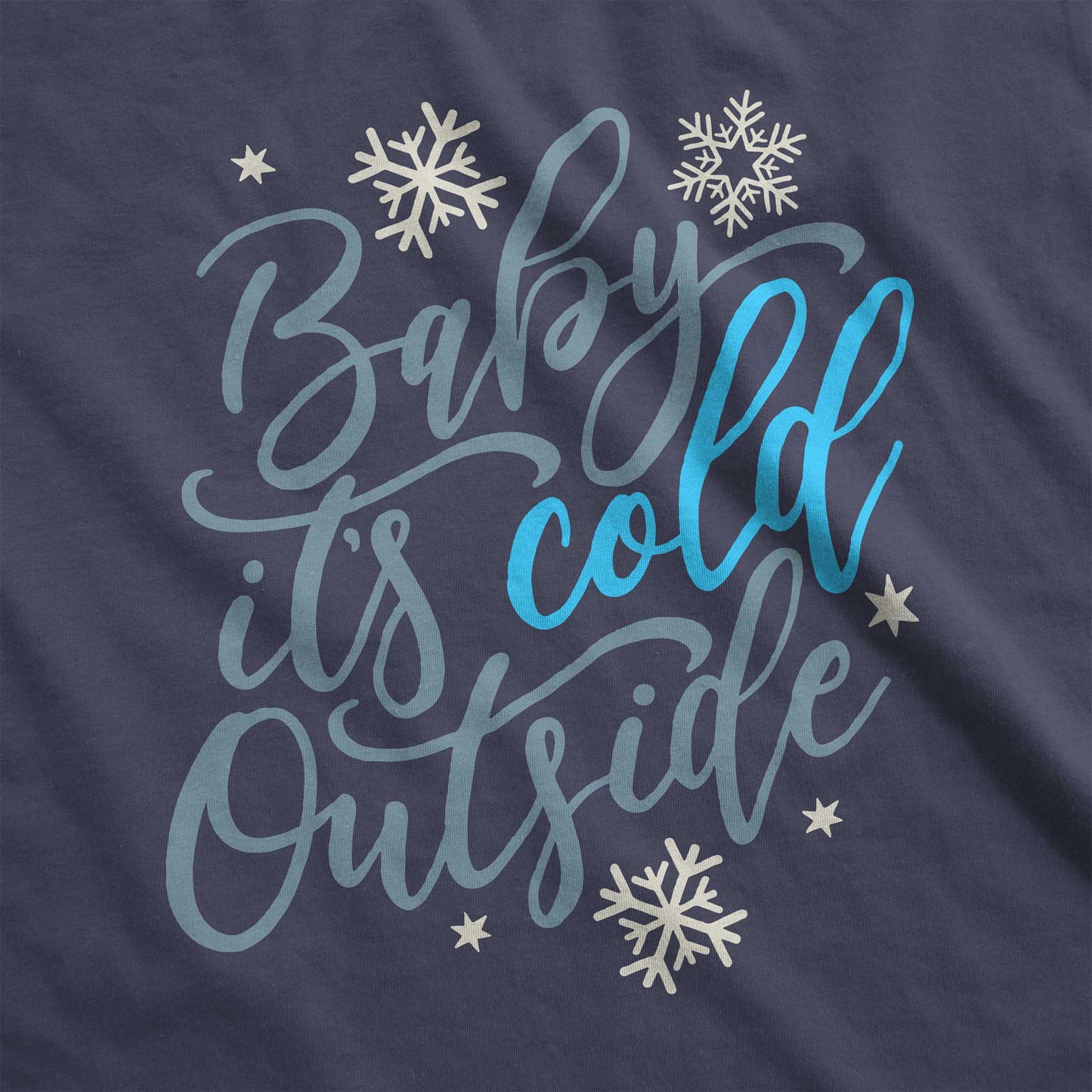 A navy Tultex swatch featuring snowflakes and the words baby it's cold outside.