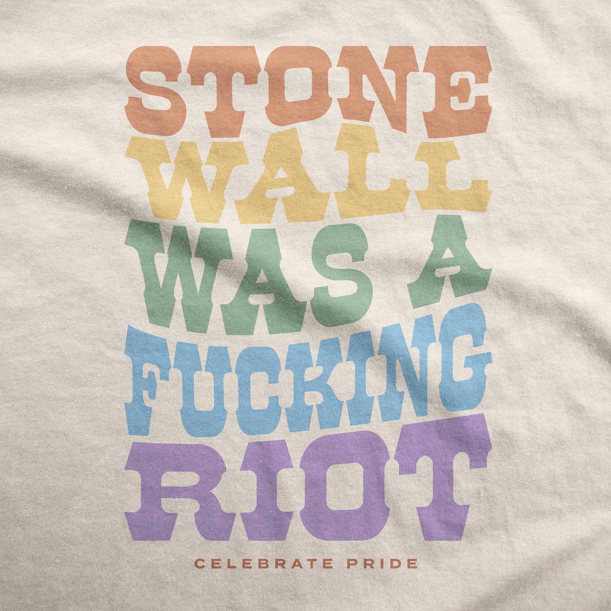 A soft cream Bella Canvas swatch that says Stonewall was a fucking riot celebrate pride.