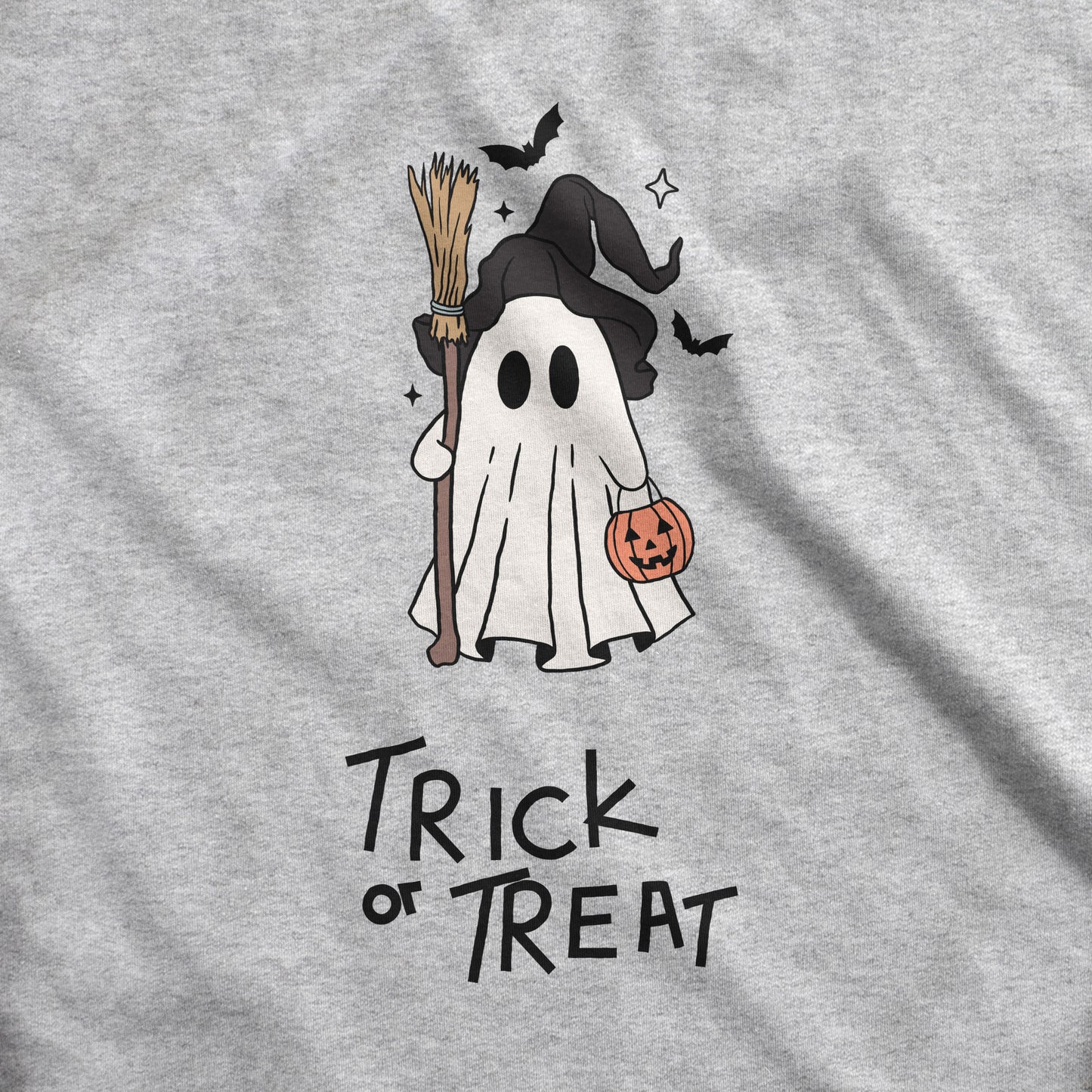 A sport grey Gildan swatch featuring a cute cartoon witch ghost with the words trick or treat.