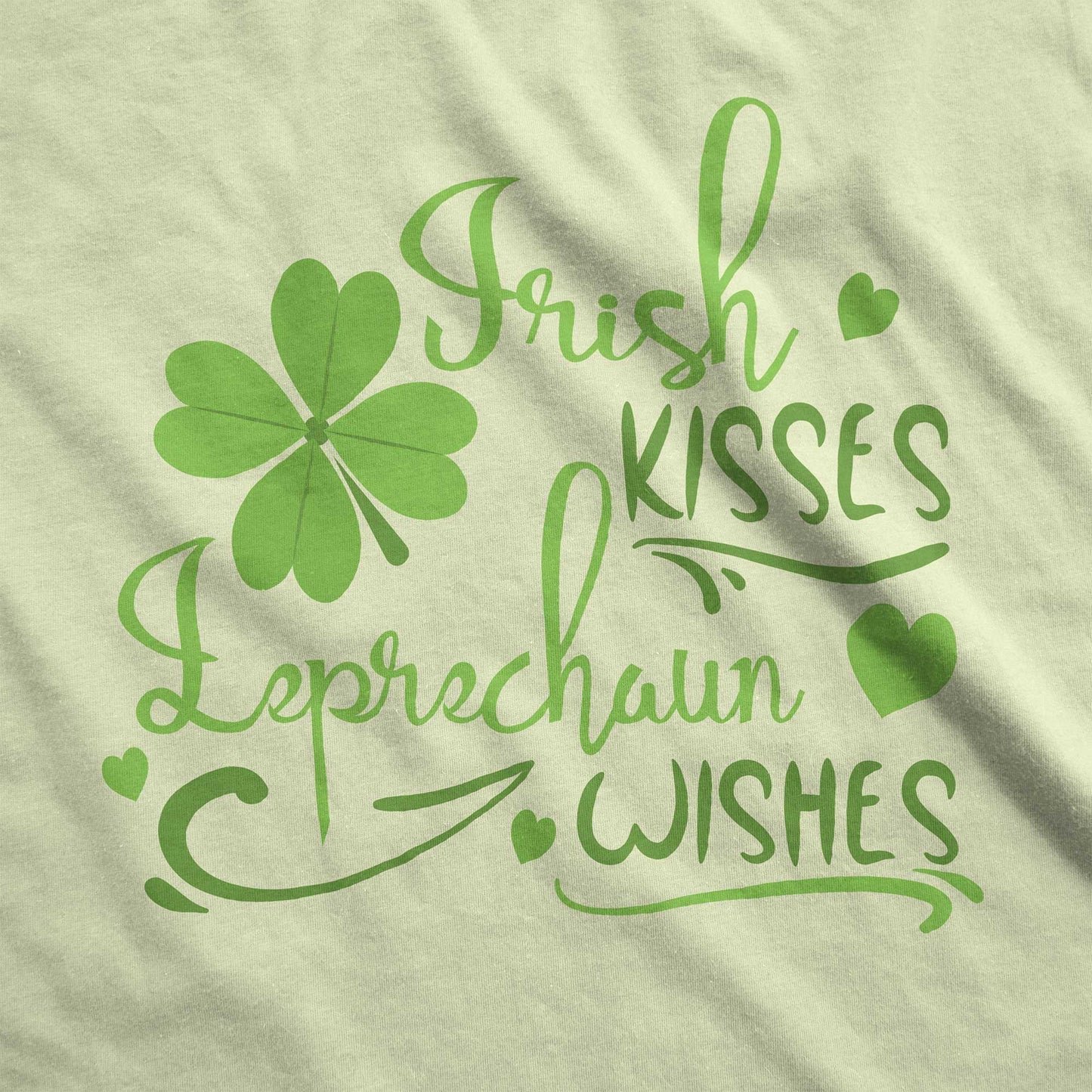 A spring green Bella Canvas swatch with a shamrock and the words irish kisses leprachaun wishes