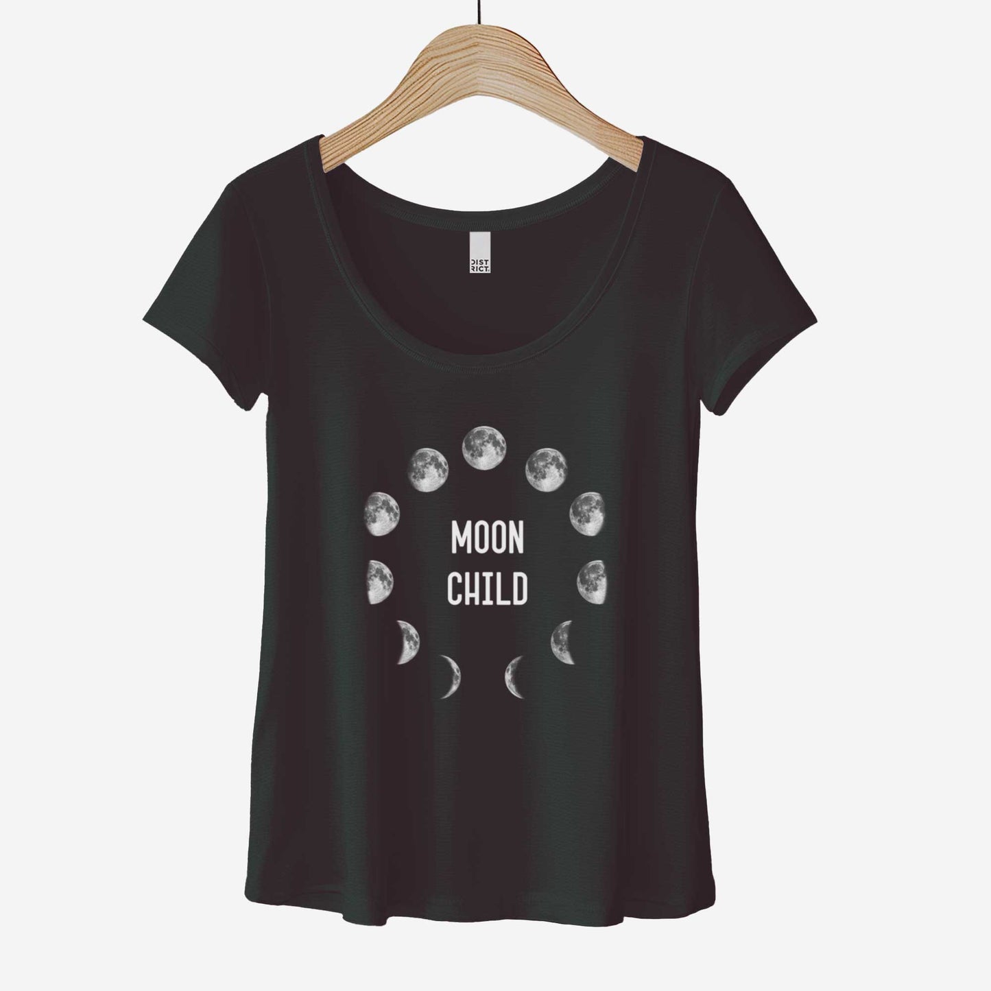 A black District 7501 scoop neck t-shirt with the phases of the moon in a circle and the words moon child in the center.