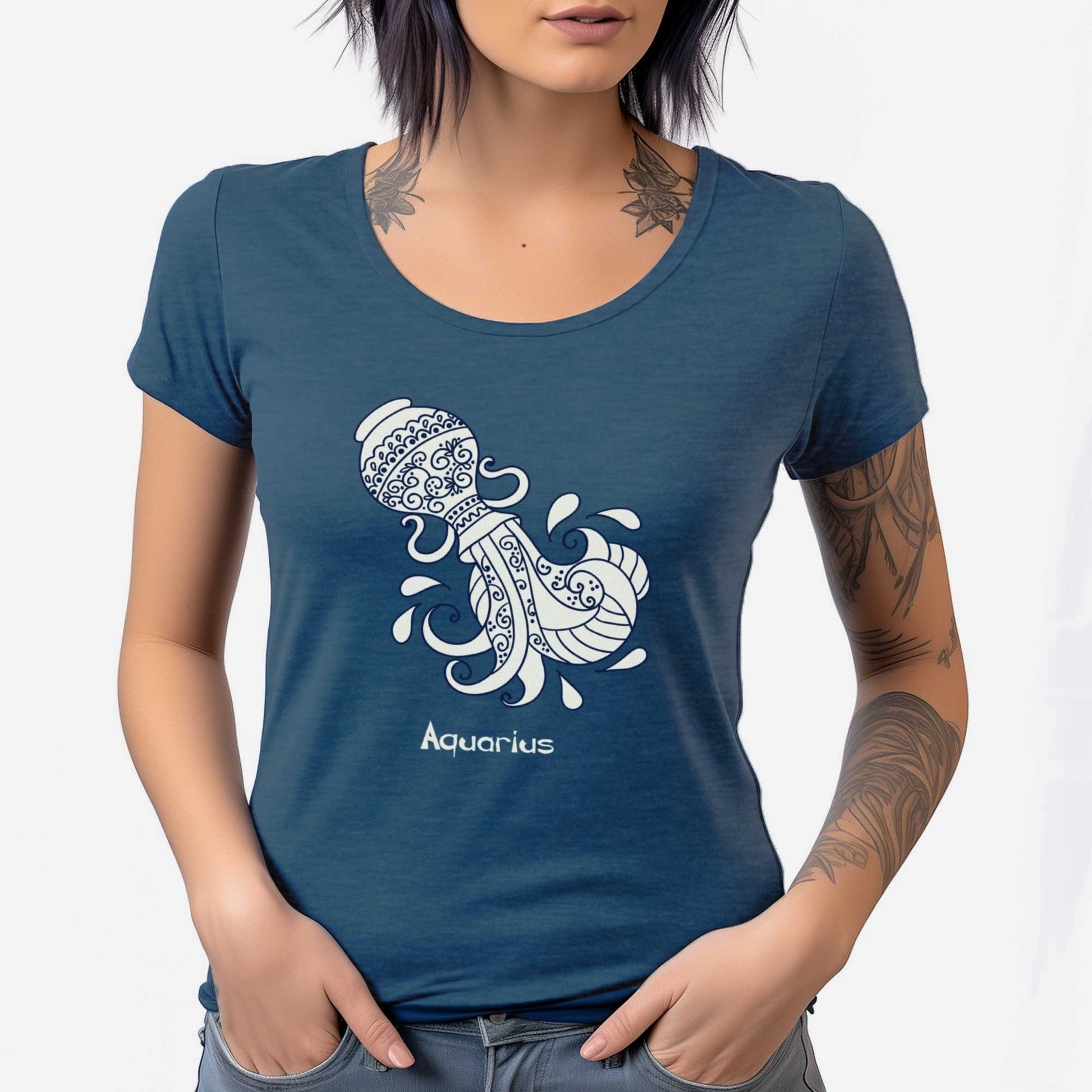 A woman wearing a heathered neptune blue District 7501 scoop neck t-shirt featuring the zodiac symbol of Aquarius, a water jug, in a Mediterranean style.