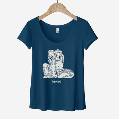 A hanging heathered neptune District 7501 scoop neck t-shirt featuring the zodiac symbol of Gemini, the twins, in a Mediterranean style illustration.