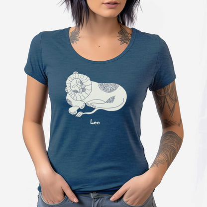 A woman wearing a heathered neptune District 7501 scoop neck t-shirt featuring the zodiac symbol of Leo, the lion, in a Mediterranean style.