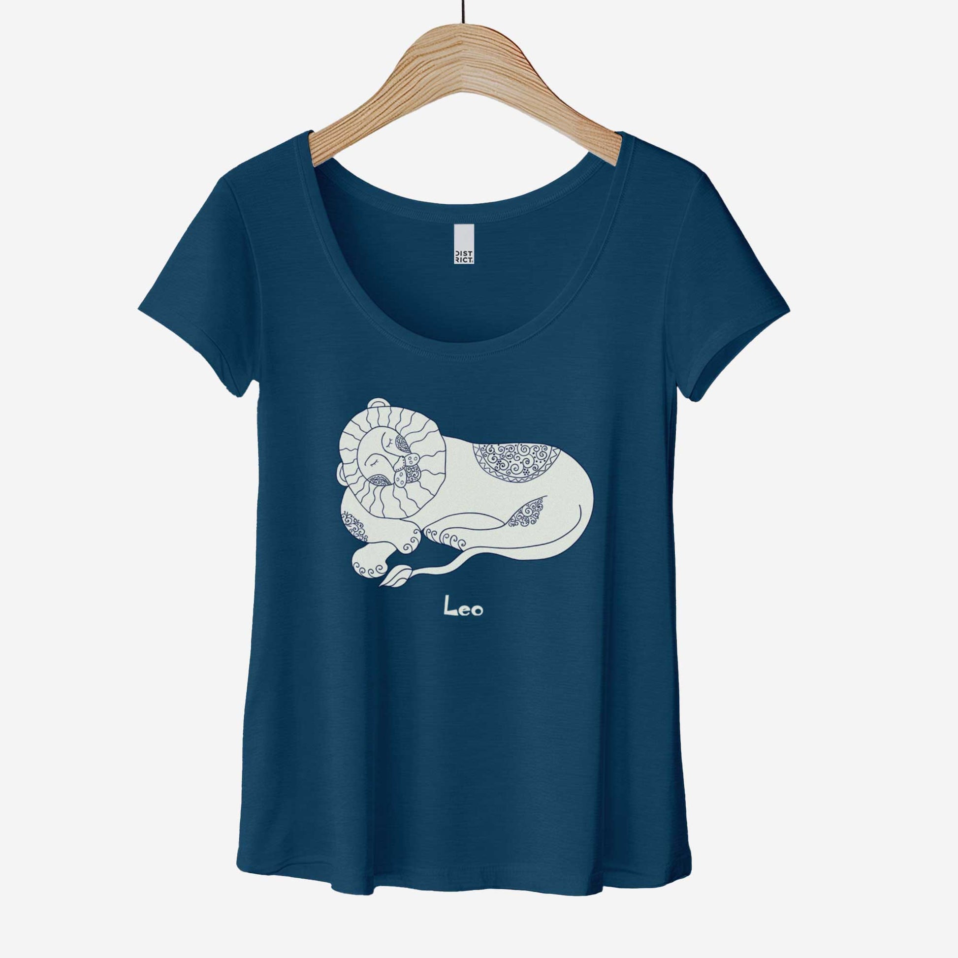 A hanging heathered neptune District 7501 scoop neck t-shirt featuring the zodiac symbol of Leo, the lion, in a Mediterranean style illustration.