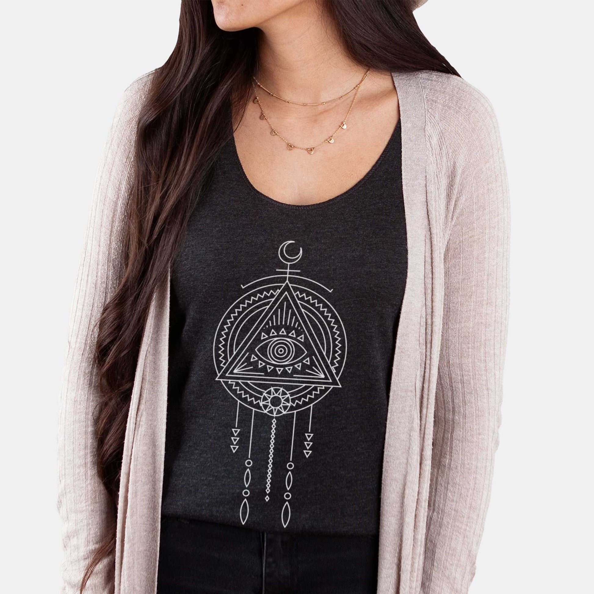 A woman wearing a vintage black Next Level racerback tank featuring an eye of providence symbol in a minimalist dream catcher line art.