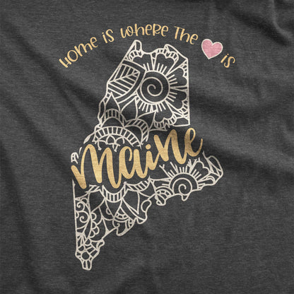 A dark grey heather Bella Canvas t-shirt swatch featuring a mandala in the shape of Maine with the words home is where the heart is.
