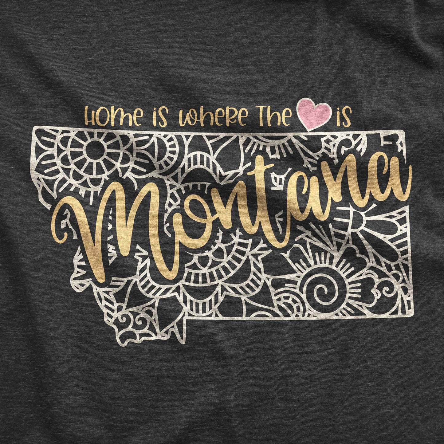 A dark grey heather Bella Canvas swatch featuring a mandala in the shape of Montana with the words home is where the heart is.