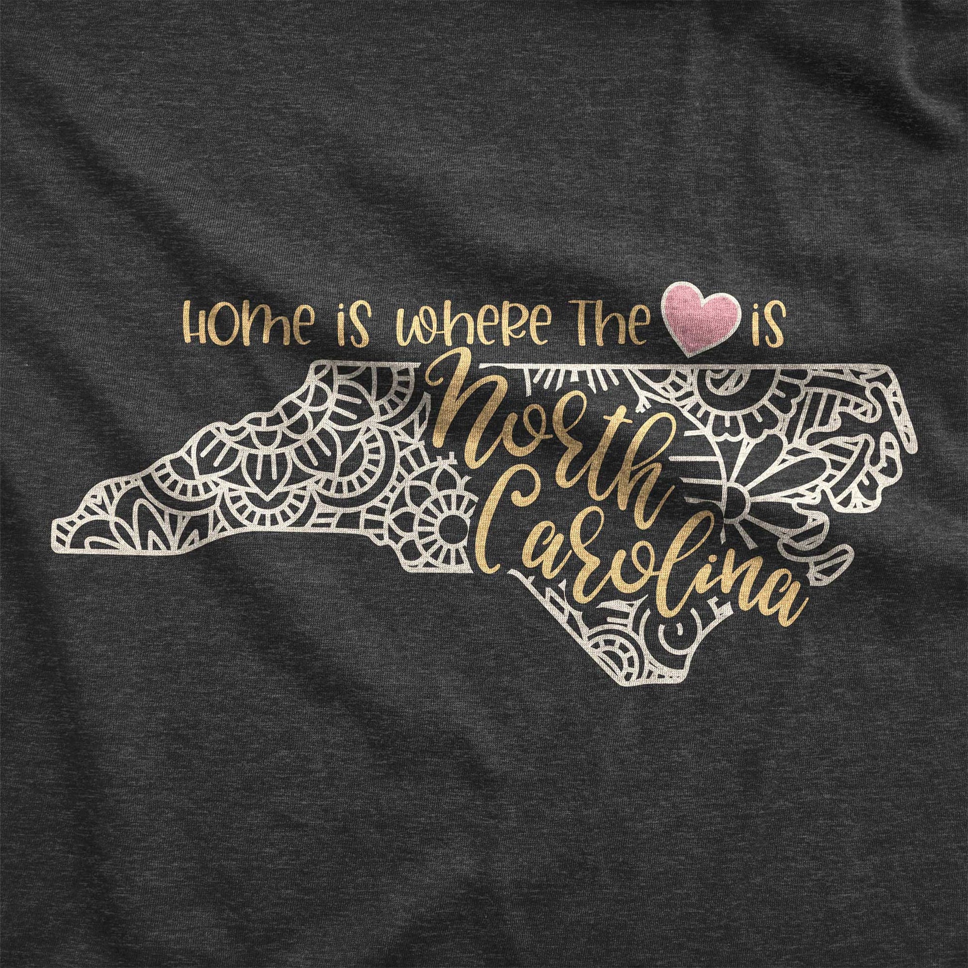 A dark grey heather Bella Canvas swatch featuring a mandala in the shape of North Carolina with the words home is where the heart is.