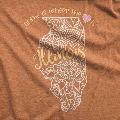 A heather autumn Bella Canvas swatch featuring a mandala in the shape of Illinois with the words home is where the heart is.