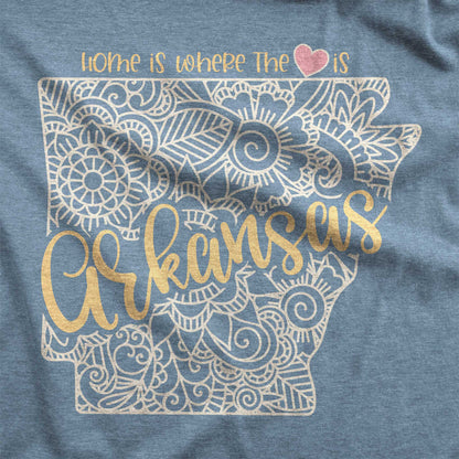 A heather slate Bella Canvas swatch featuring a mandala in the shape of rkansas with the words home is where the heart is.